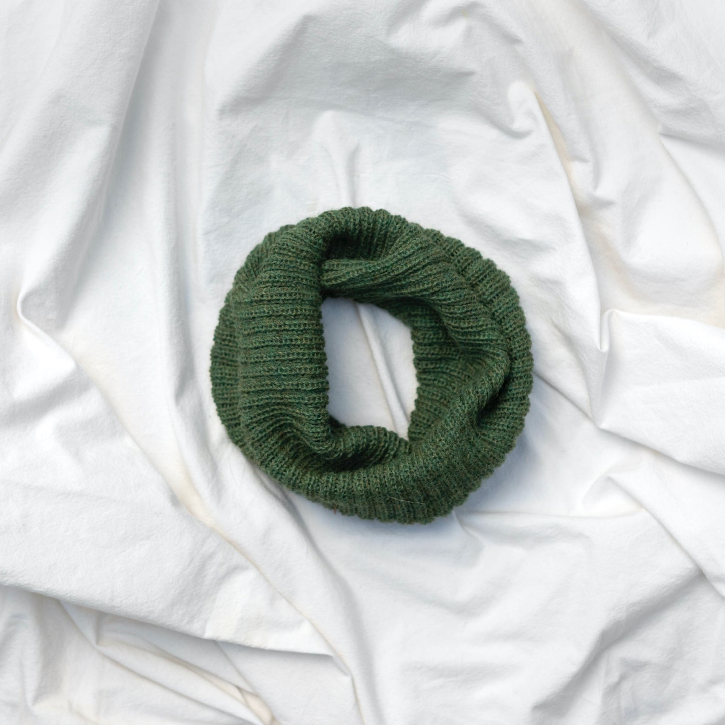 Green coloured neck warmer made from the softest baby alpaca wool