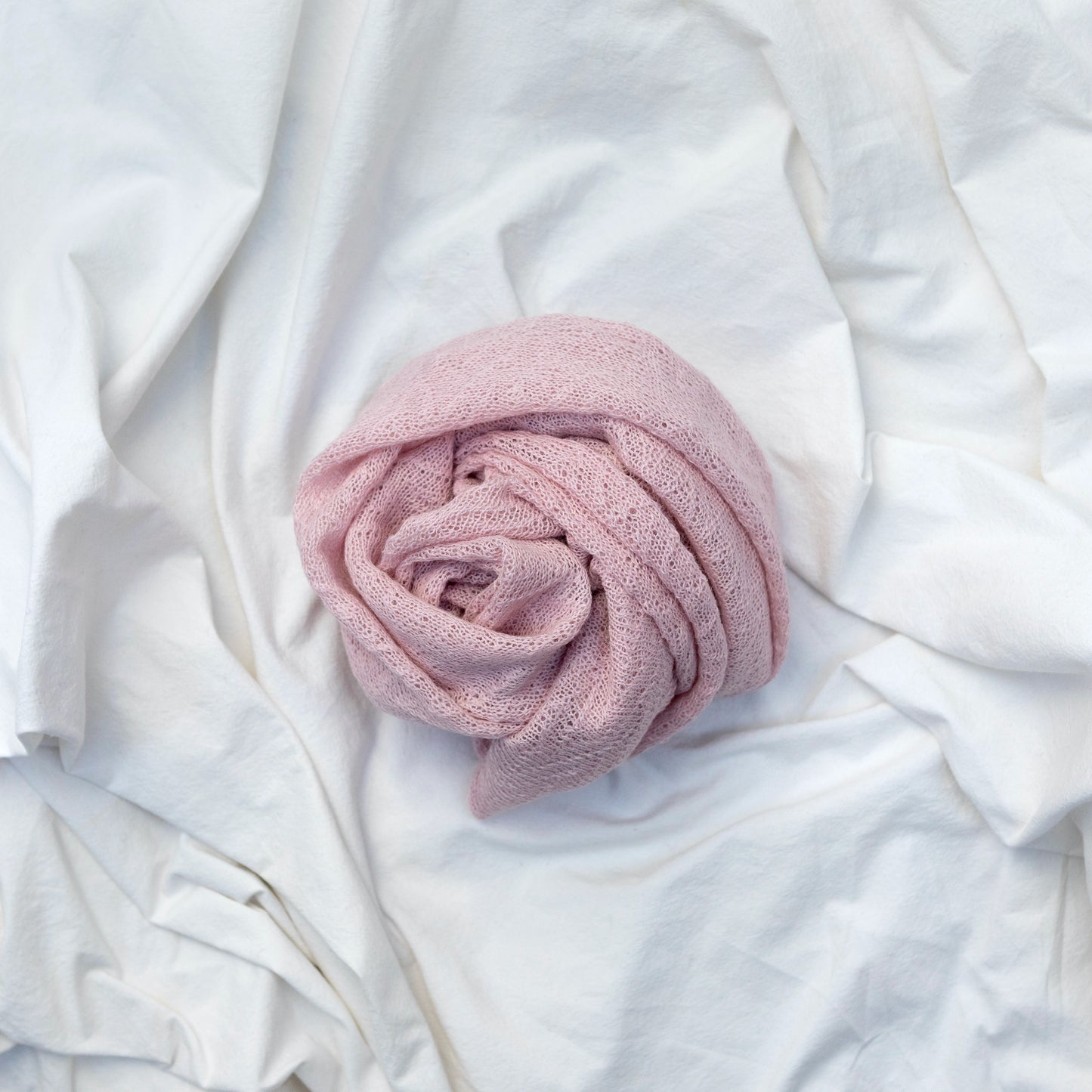 Pale pink coloured lightweight and delicately woven alpaca scarf. Handmade by artisans
