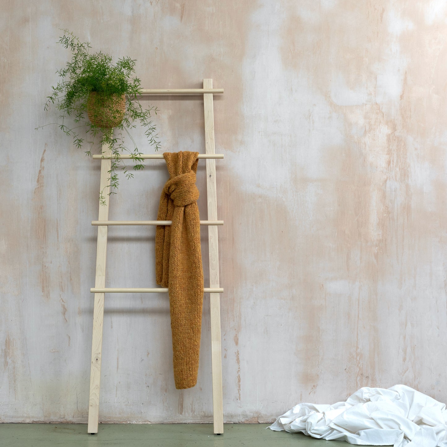 Yellow coloured chunky scarf hanging from wooden ladder. Super soft alpaca wool