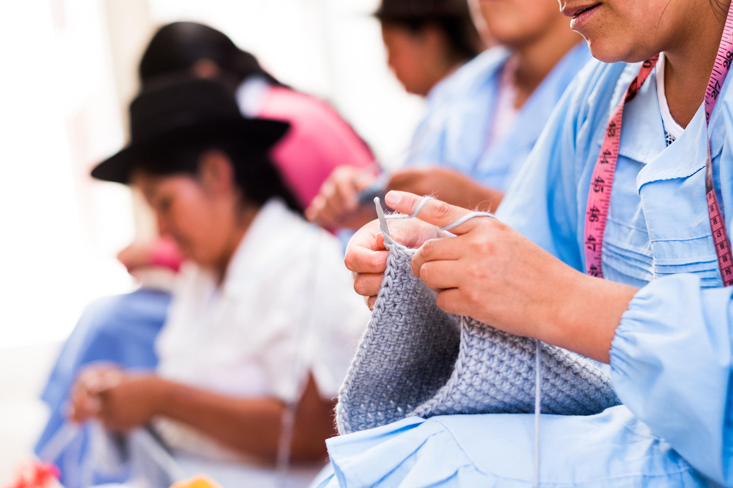 Photo of our makers knitting 