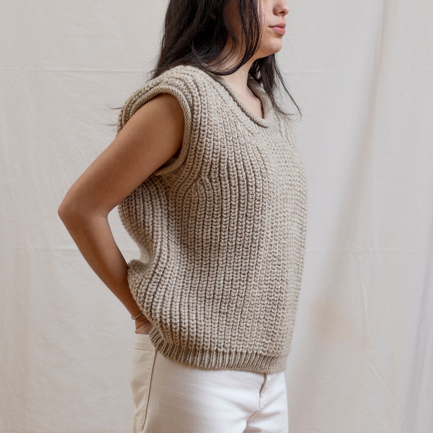 Woman wearing luxury alpaca wool hand-knitted vest.