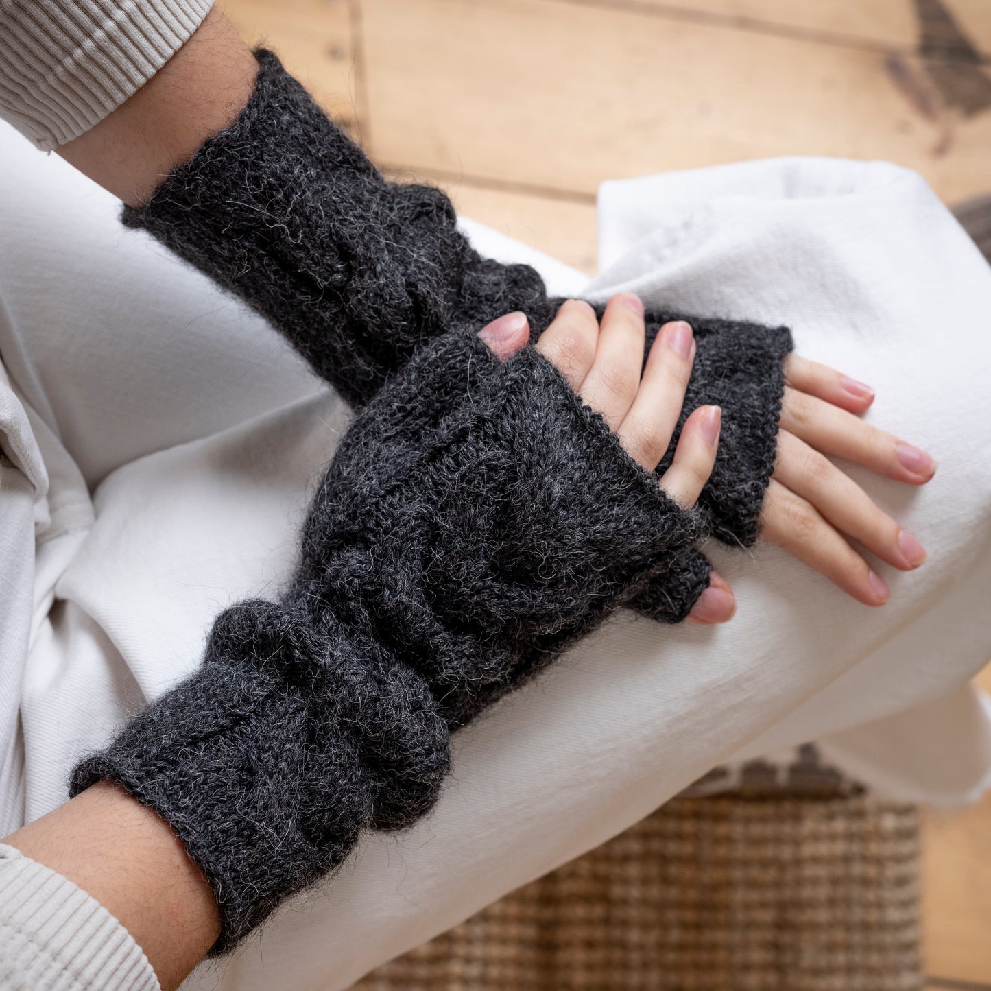 Charcoal coloured, super-soft and silky hand-knitted alpaca wool mittens.