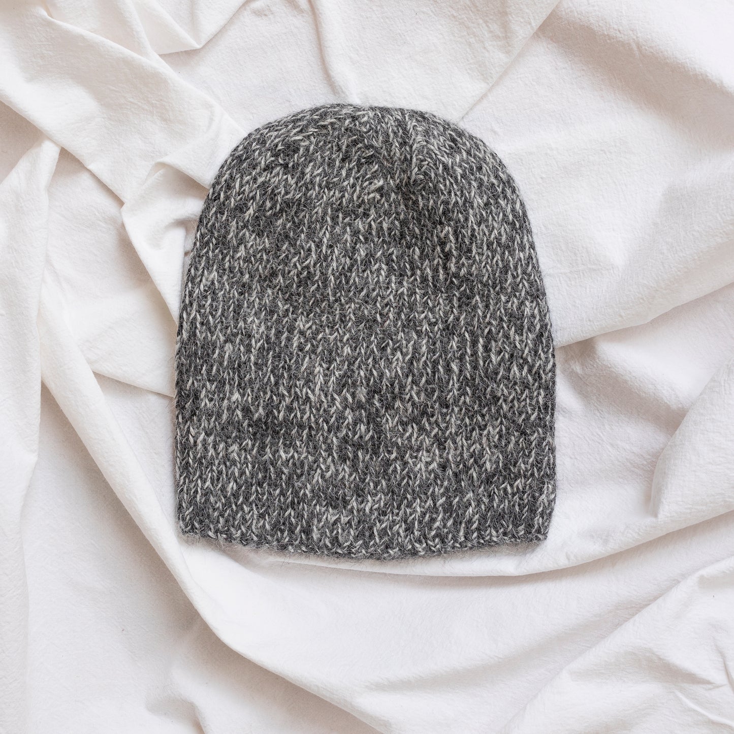 Soft and luxurious alpaca knit fisherman's beanie in color charcoal.