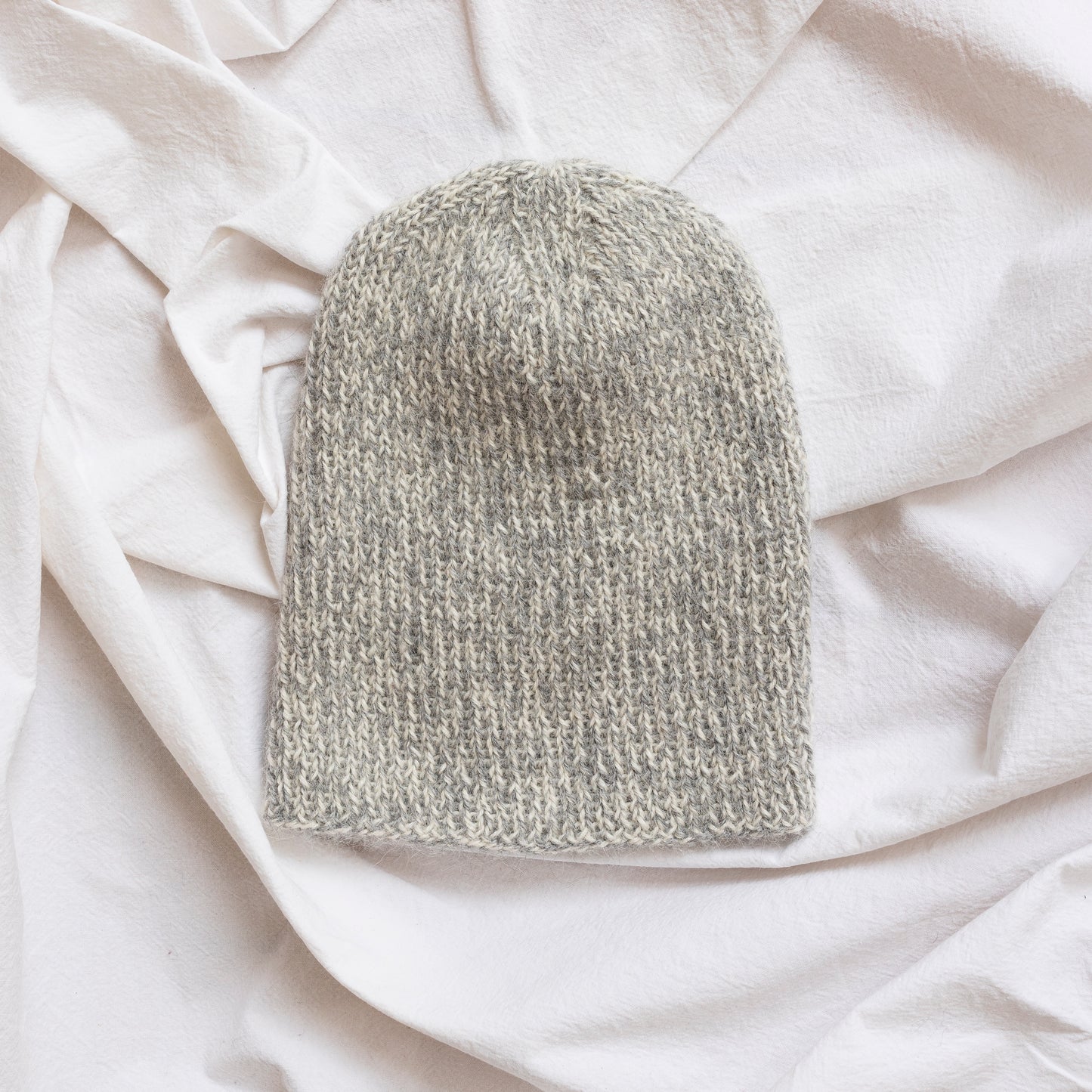 Soft and luxurious alpaca knit fisherman's beanie in color beige.
