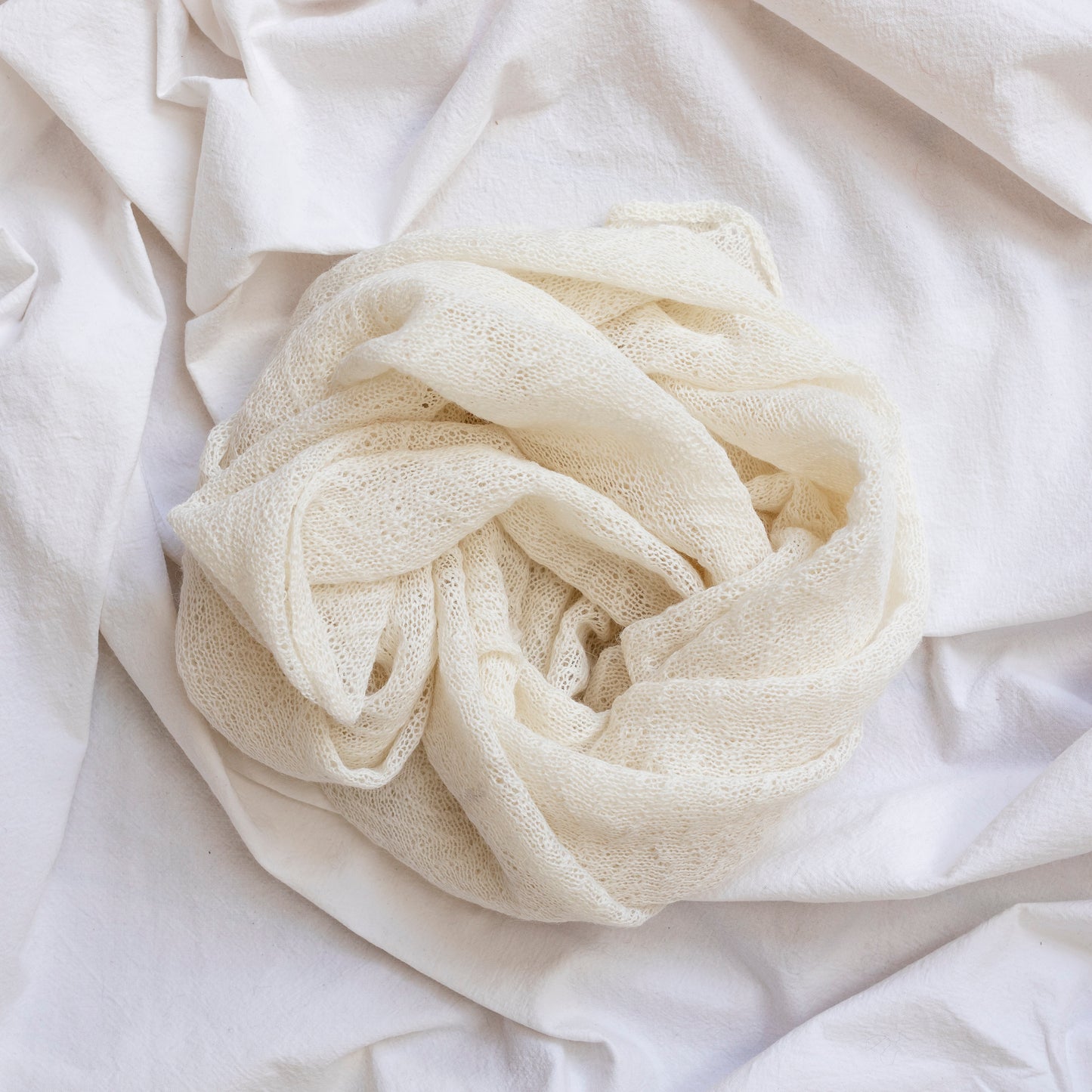 Natural coloured lightweight and delicately woven scarf. Hand-made by artisans.