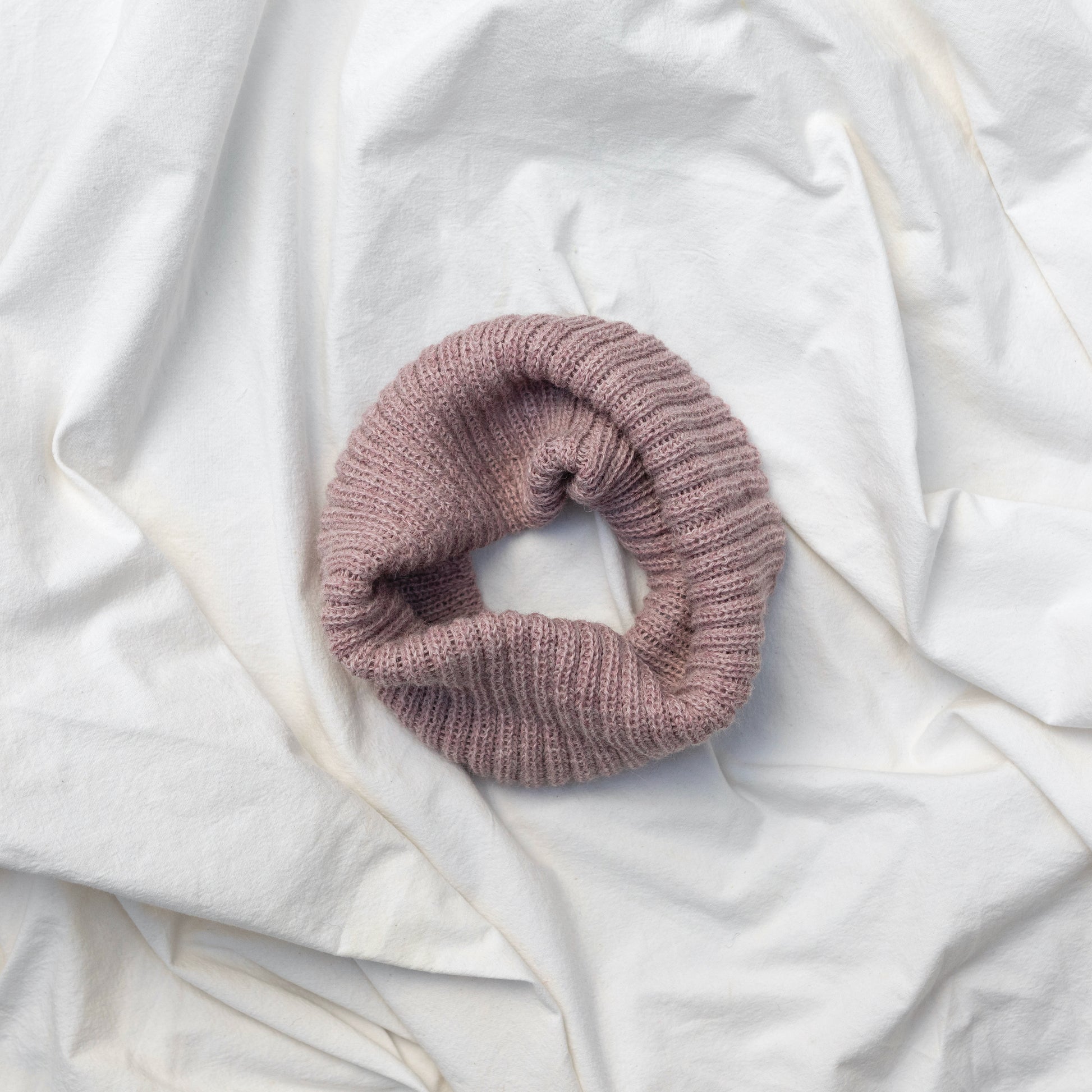 Soft pink coloured neck warmer made from the softest baby alpaca wool 