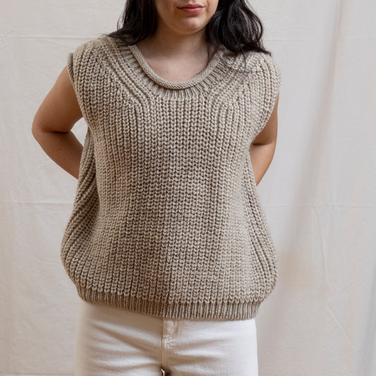 Woman wearing luxury alpaca wool hand-knitted vest. 