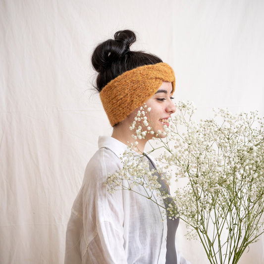 woman wearing stylish handmade yellow alpaca headband, ear warmer