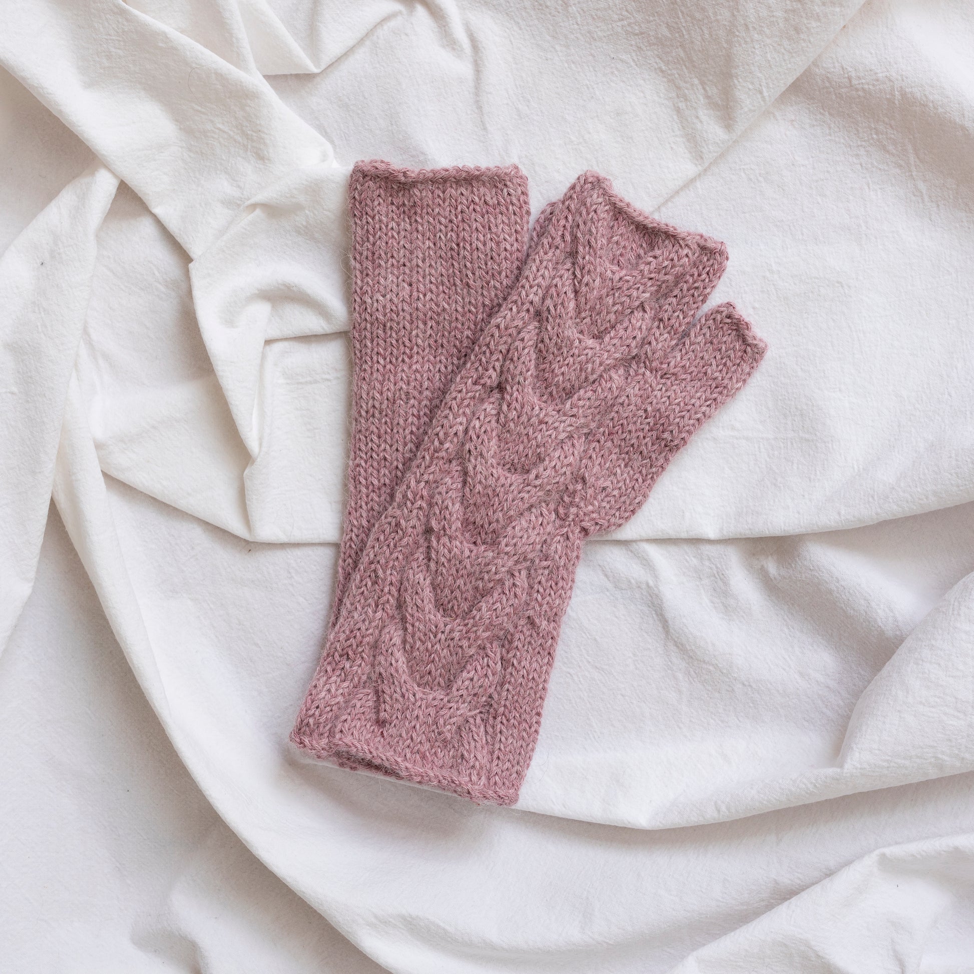Rose pink coloured, super-soft and silky hand-knitted alpaca wool mittens.