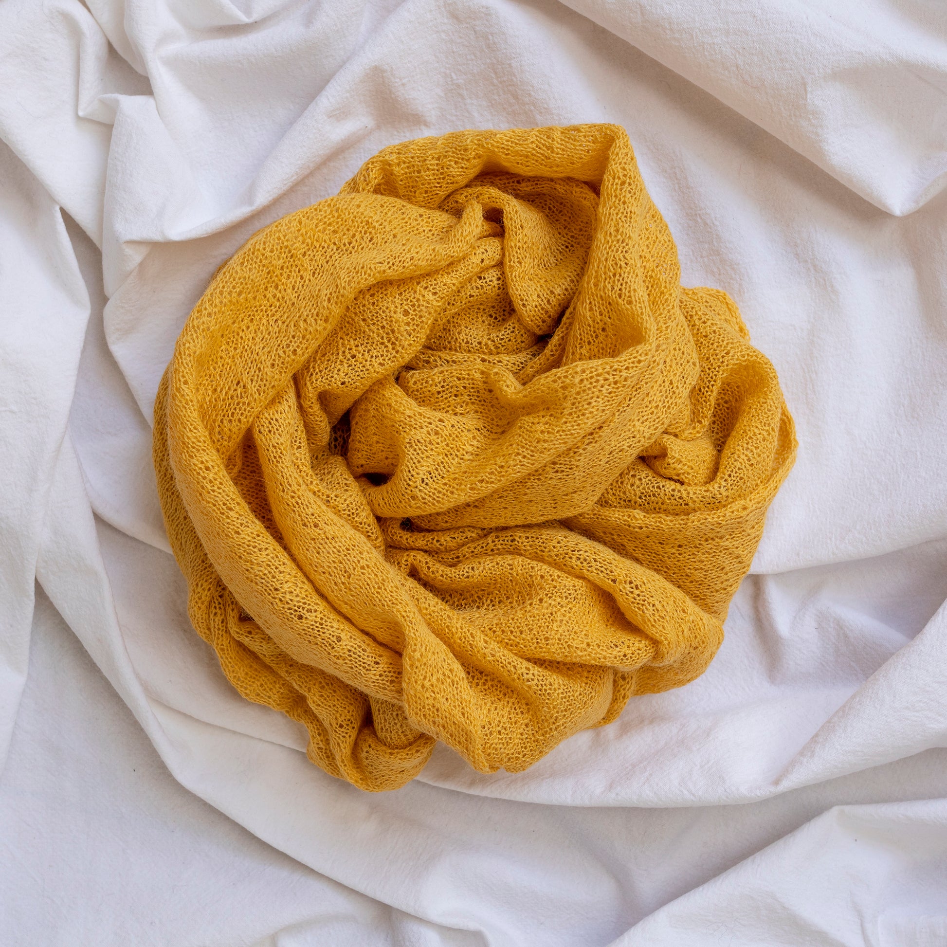 Yellow coloured lightweight and delicately woven scarf. Hand-made by artisans.