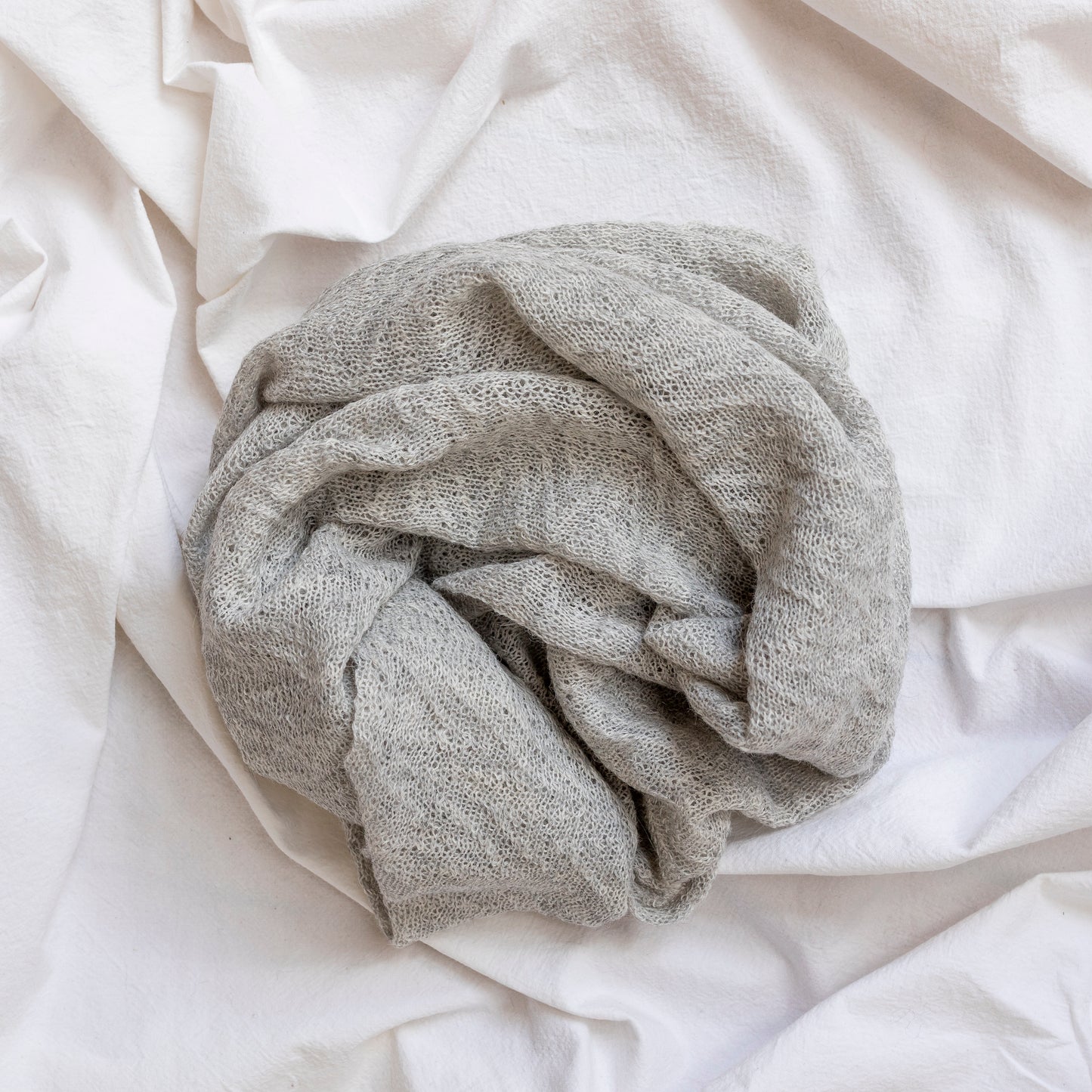 Soft grey coloured lightweight and delicately woven scarf. Hand-made by artisans.